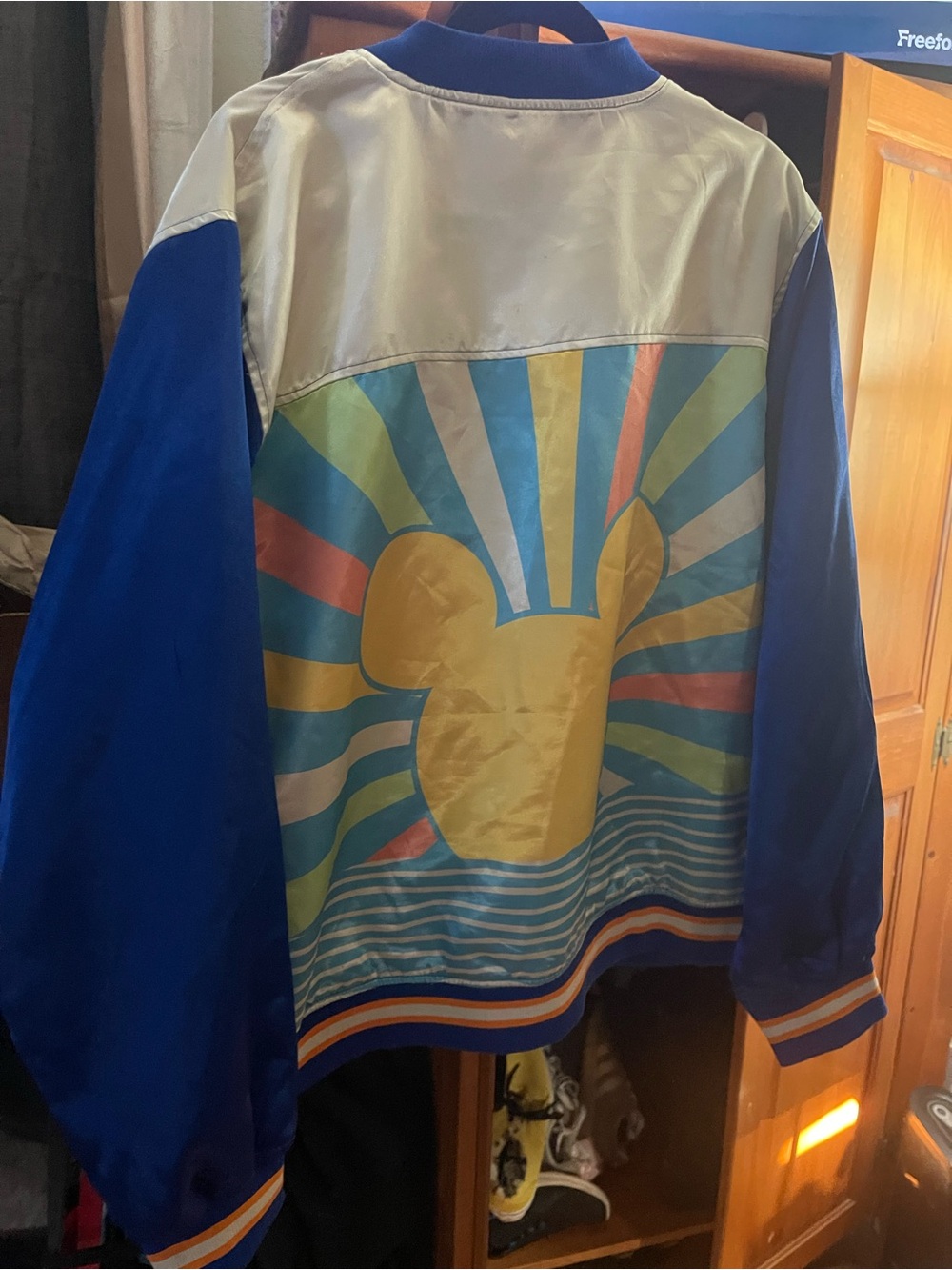 A Blue Retro Sunburst Jacket with Yellow Graphic